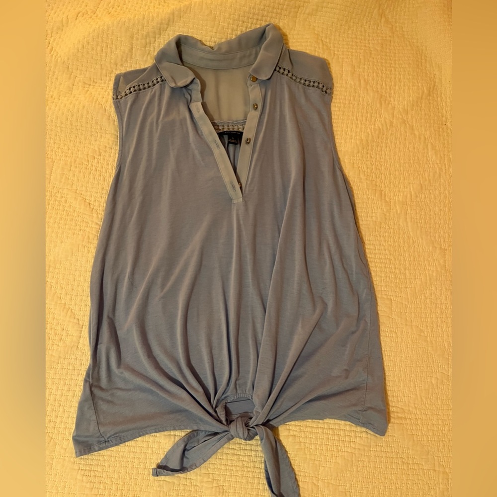 Sleeveless blue blouse